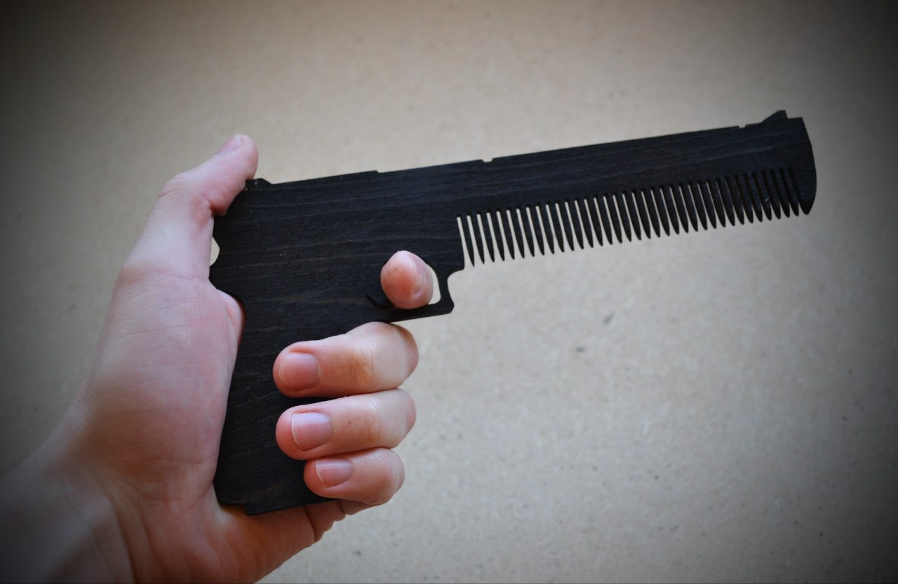 Laser Cut Gun Hair Comb Free Vector