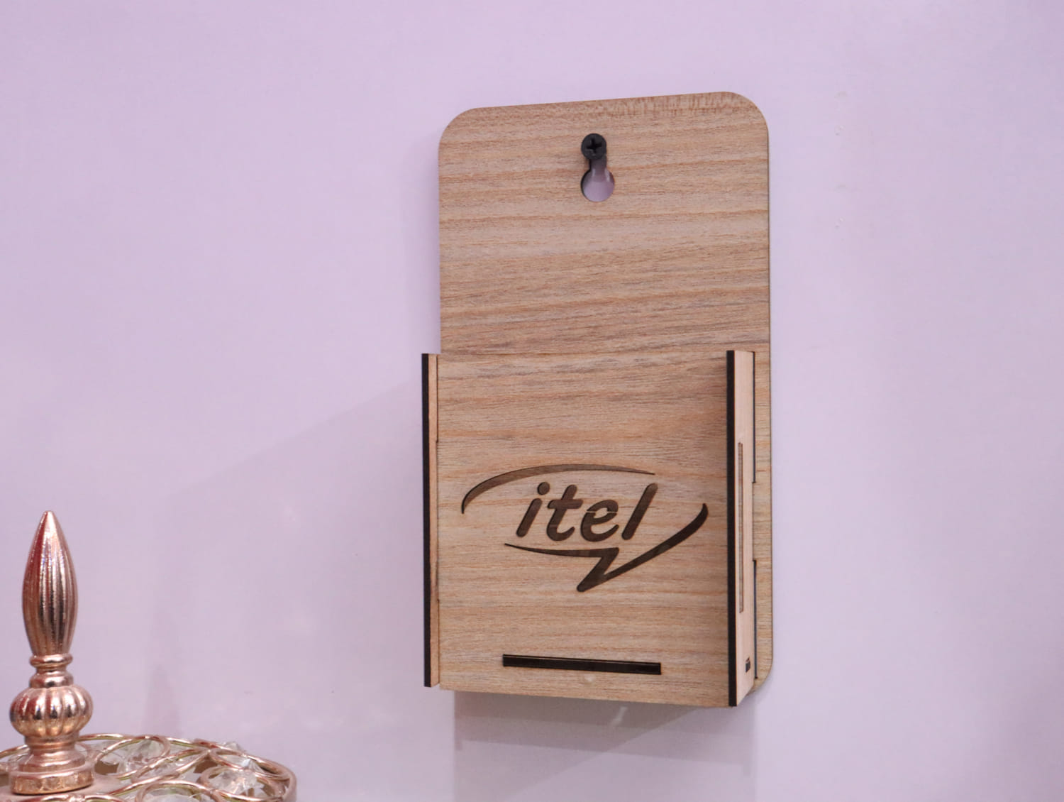 Laser Cut Wall Mounted Mobile Holder With Itel Logo Free Vector