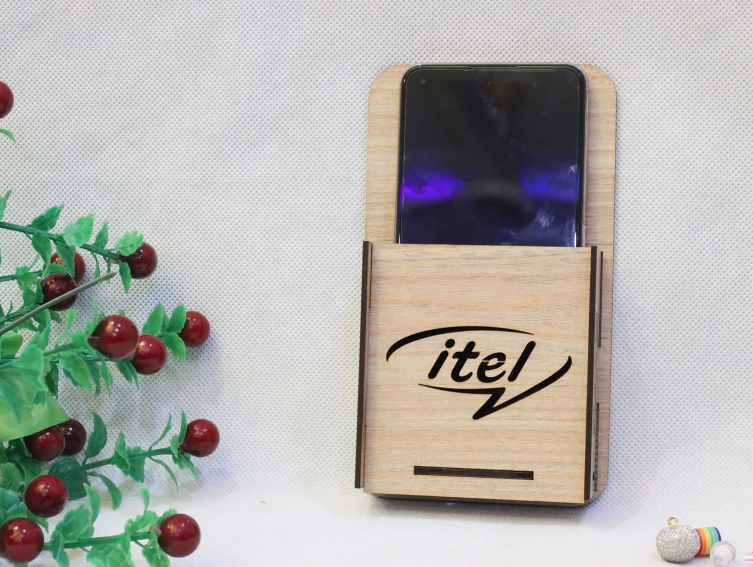 Laser Cut Wall Mounted Mobile Holder With Itel Logo Free Vector