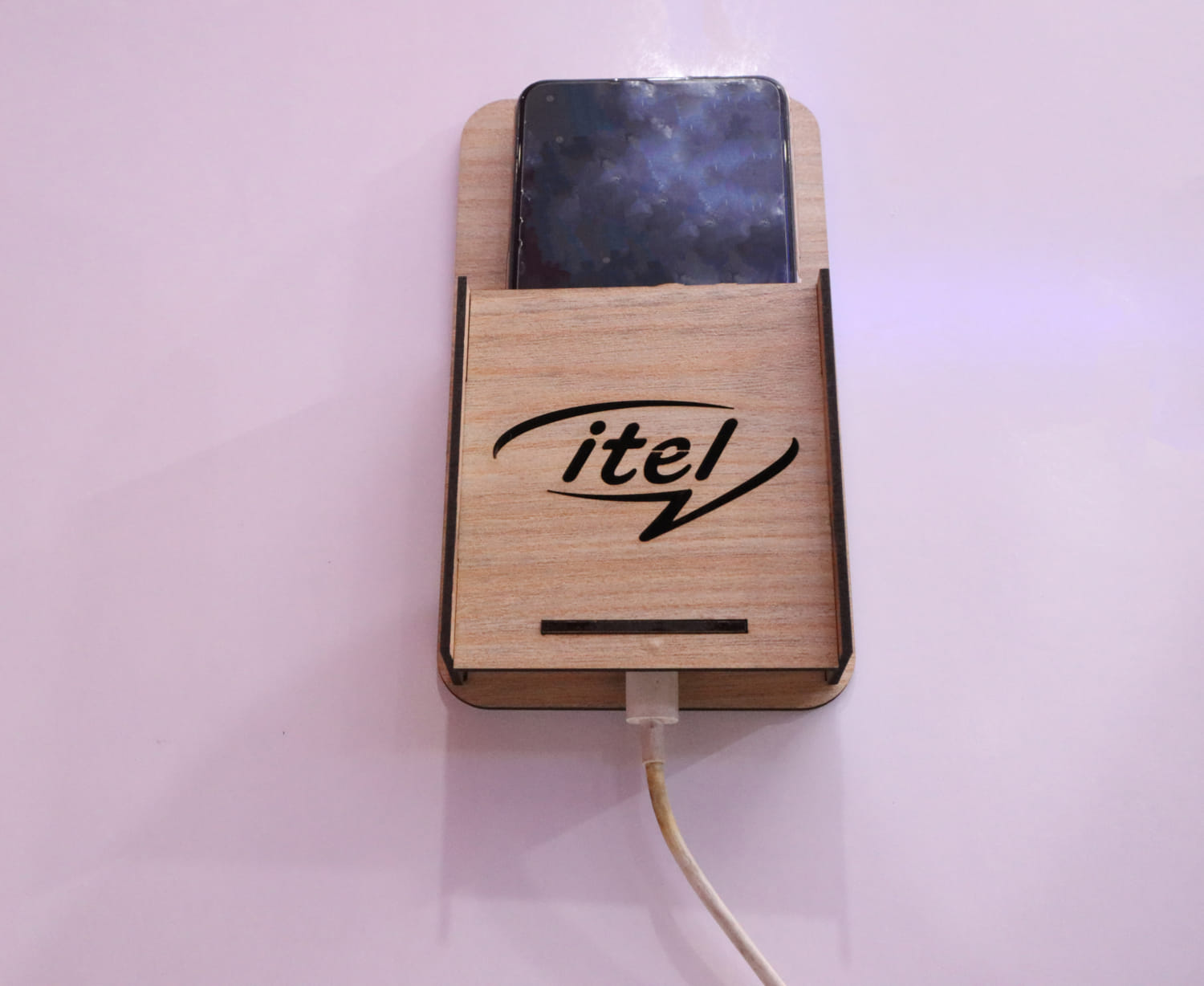 Laser Cut Wall Mounted Mobile Holder With Itel Logo Free Vector