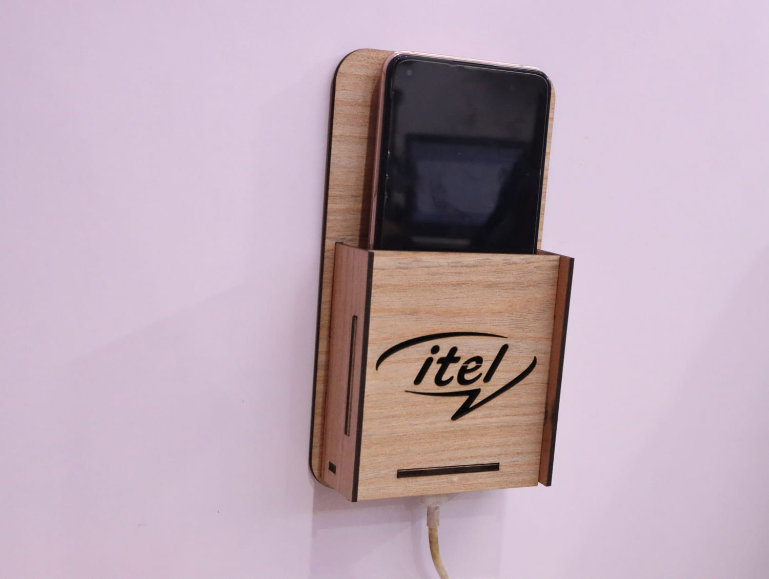 Laser Cut Wall Mounted Mobile Holder With Itel Logo Free Vector