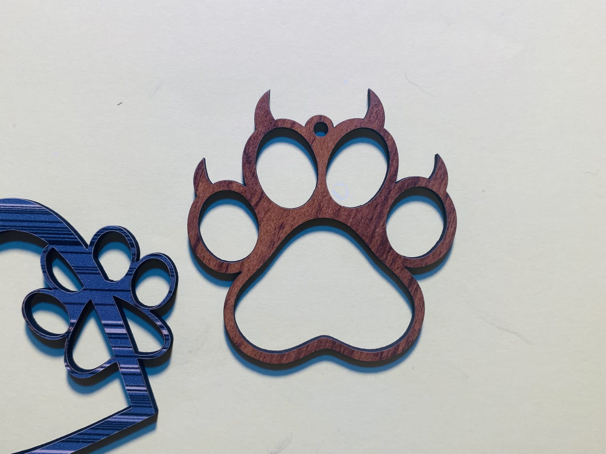 Laser Cut Wooden Paw Print Ornament Free Vector