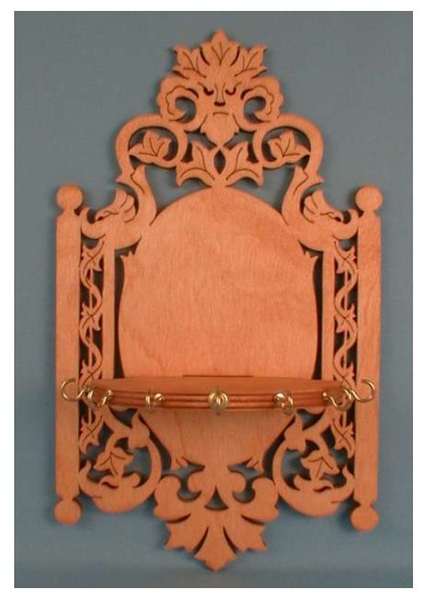 Laser Cut Decorative Wall Shelf with Hangers Free Vector