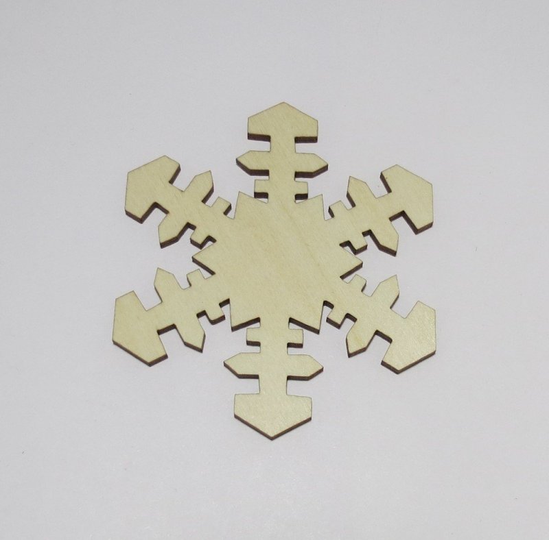 Laser Cut Snowflake Shaped Coasters Made of Birch Plywood