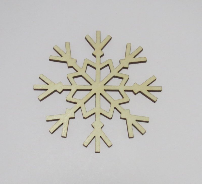 Laser Cut Snowflake Shaped Coasters Made of Birch Plywood