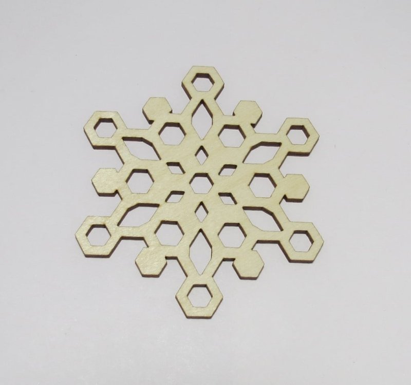 Laser Cut Snowflake Shaped Coasters Made of Birch Plywood