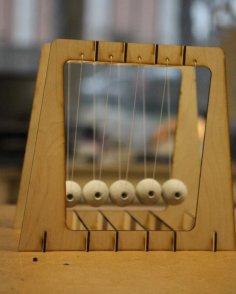 Laser Cut Newton’s Cradle Free Vector